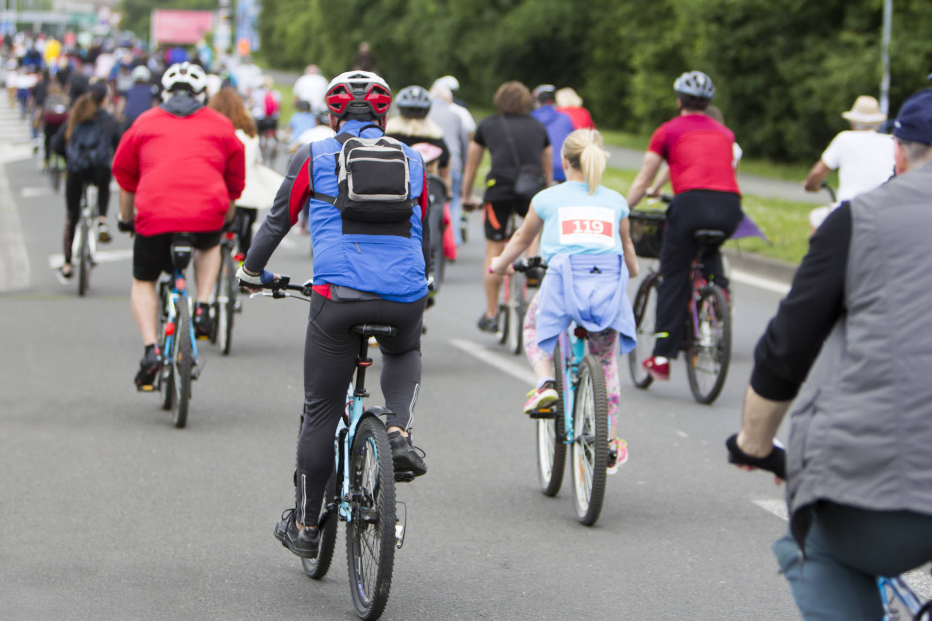 A large group of cyclists on the street