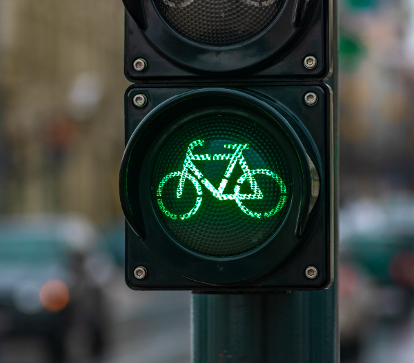 Closeup of a traffic signal with a bicycle shaped green light